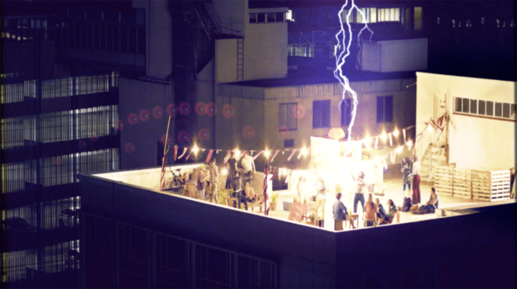 A lightning strikes a man at a roof party